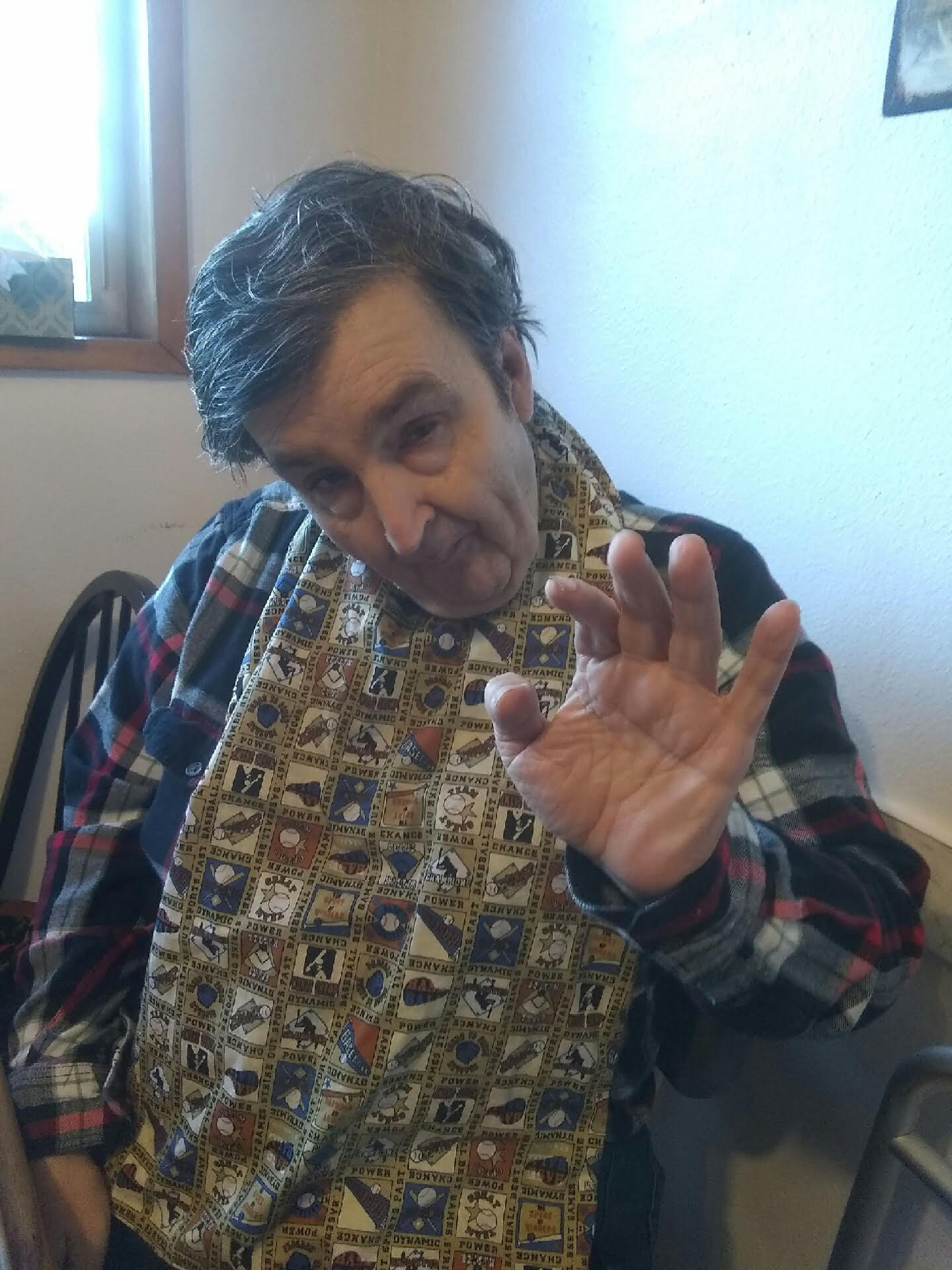 Man waving to camera