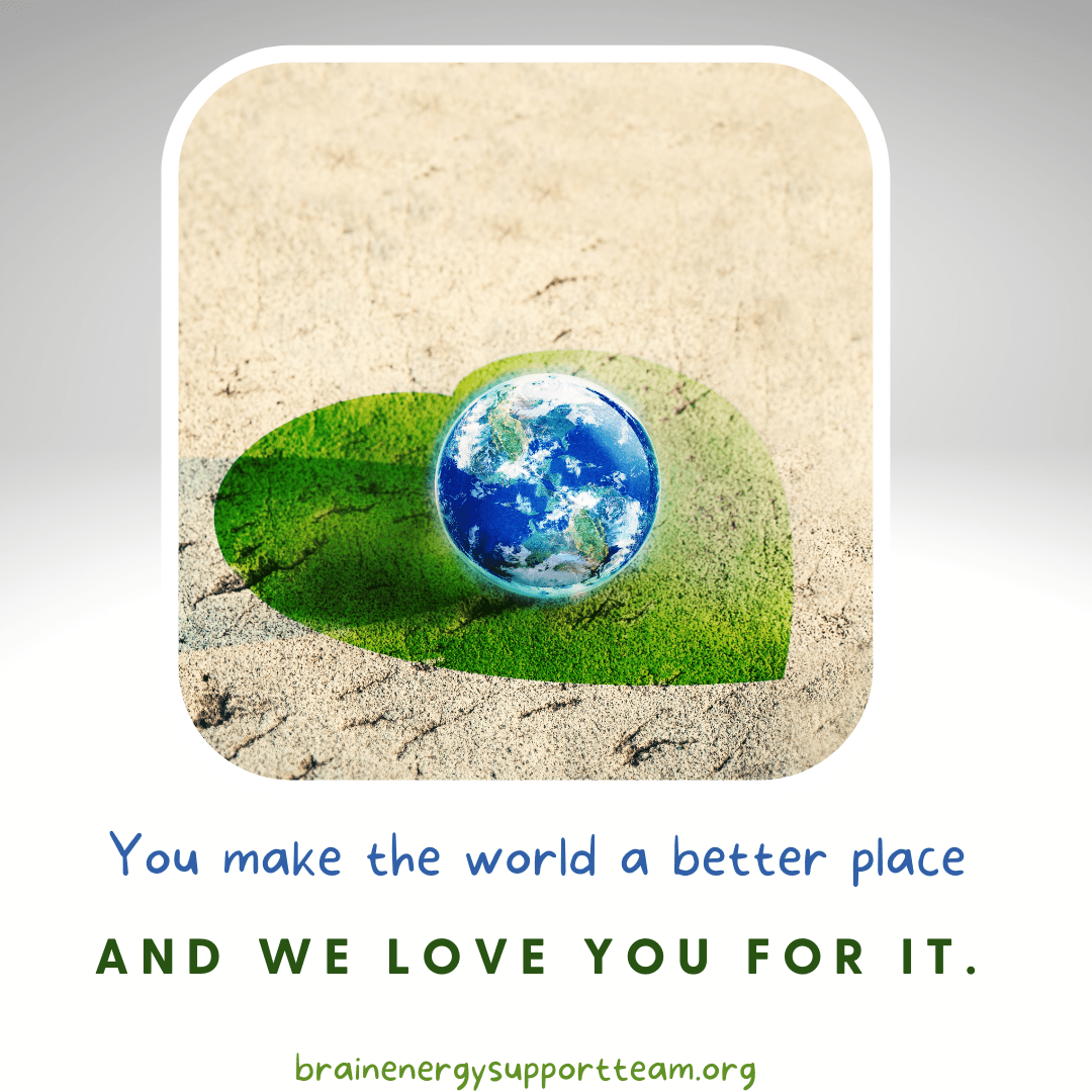 A whimsical graphic representation of a green grass heart with a small Earth (like a marble) sitting atop the heart