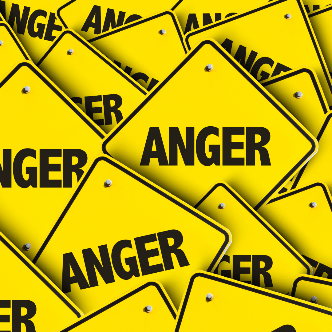 Stacks of caution signs with the word "anger" on them